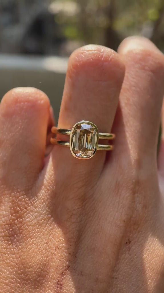 Elongated cushion champagne moissanite double shank ring rotating view