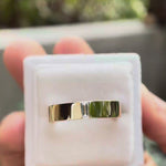 Video showcasing the cigar band rotating to highlight the comfort fit design and flush set baguette moissanite.