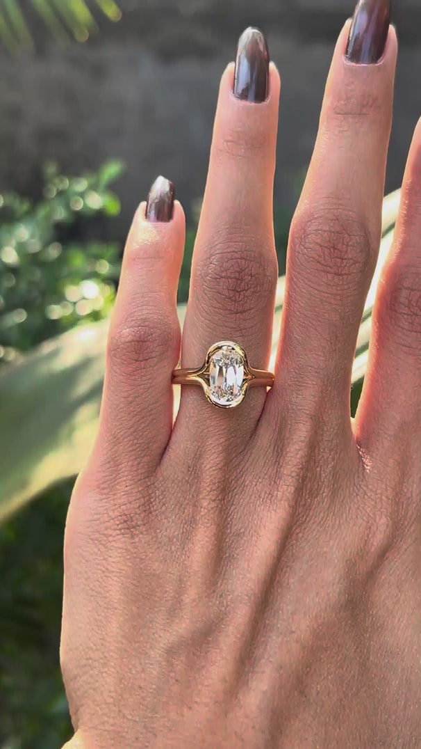 Close rotating view elongated cushion split shank diamond ring worn on hand