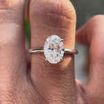 Oval lab grown diamond solitaire cathedral ring with hidden halo in 14K white gold video view