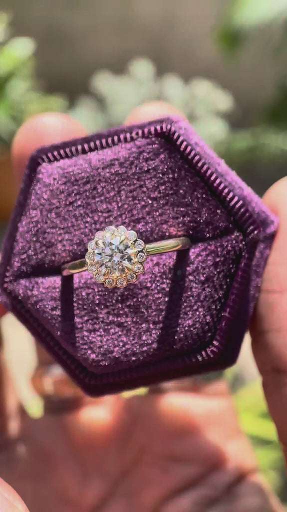 Video showcasing round lab grown diamond cathedral halo ring in 14K yellow gold