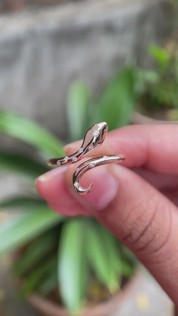 Product video showcasing the diamond snake ring in 14K rose gold from multiple angles.