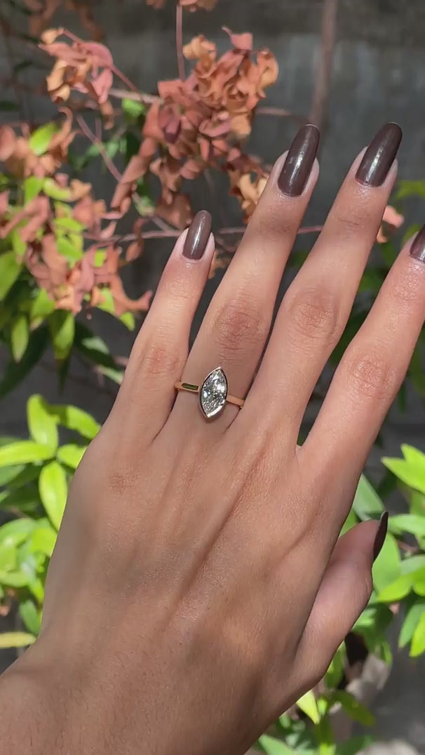 360 degree video of marquise bezel solitaire cathedral ring in yellow gold
