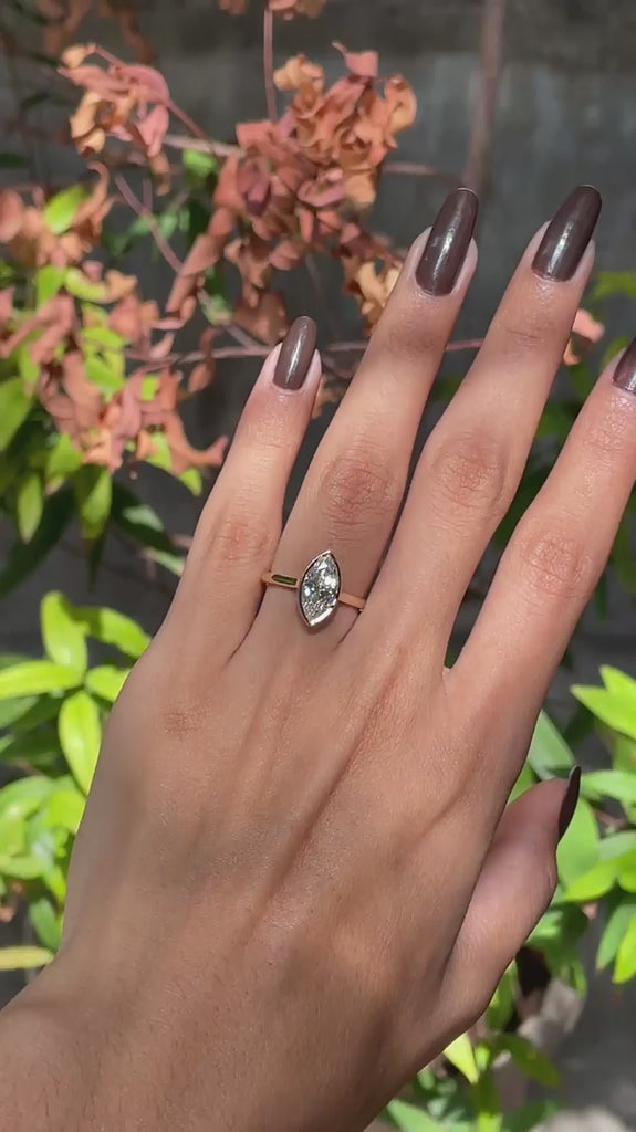 360 degree video of marquise bezel solitaire cathedral ring in yellow gold