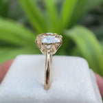 Light champagne cushion Old Mine Cut moissanite solitaire ring in 10K yellow gold rotating view