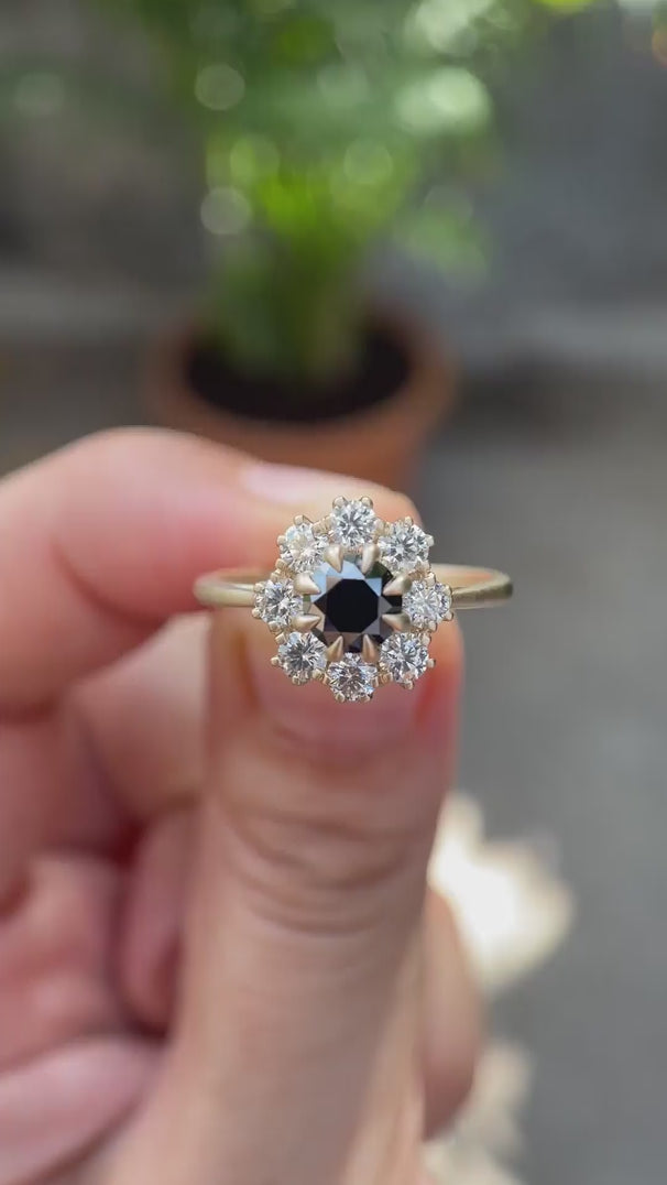 Round Old European Cut black moissanite halo ring in 10K yellow gold rotating view