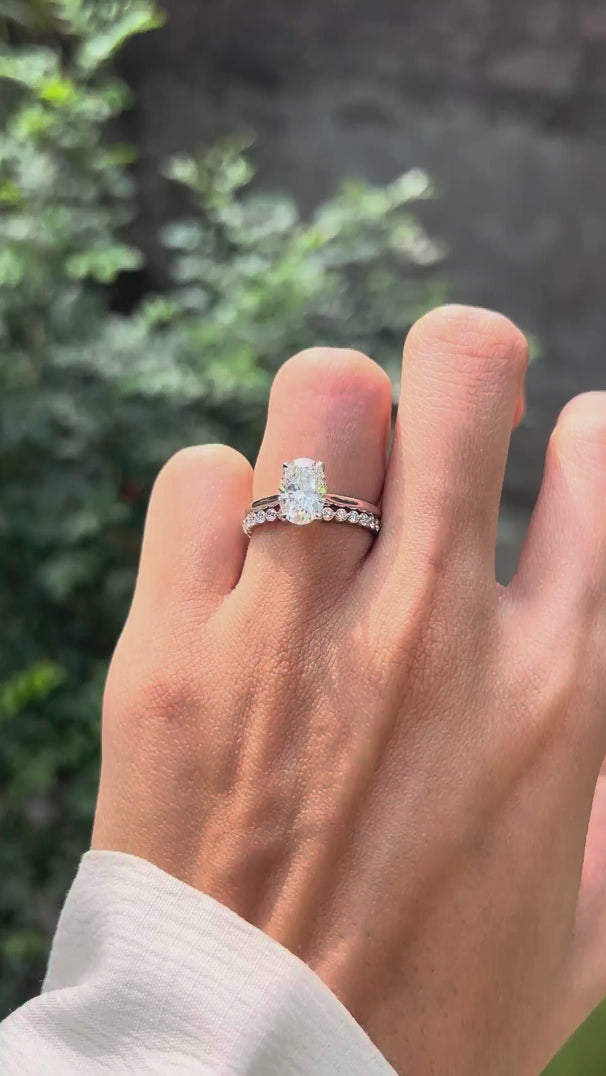 Oval lab diamond solitaire with open cuff wedding band on hand video