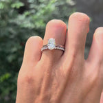 Oval lab diamond solitaire with open cuff wedding band on hand video
