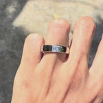 Unique platinum men’s wedding ring featuring baguette diamond and modern flat band style