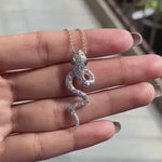 Iced out diamond serpent pendant with emerald green eyes video