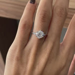 Rotating view of three stone Old European cut ring on hand