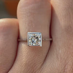 Princess cut lab grown diamond bezel solitaire ring in 14K white gold rotating view