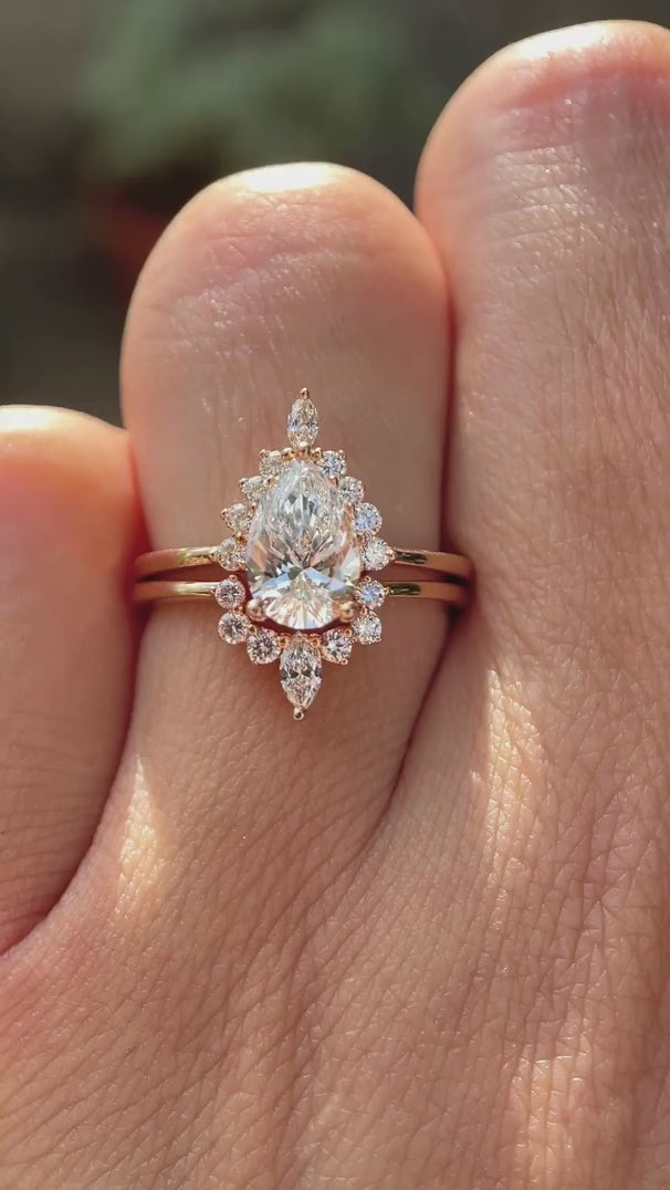 Pear lab grown diamond cluster engagement ring set in 14K rose gold shown from multiple angles