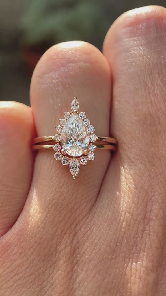 Pear lab grown diamond cluster engagement ring set in 14K rose gold shown from multiple angles