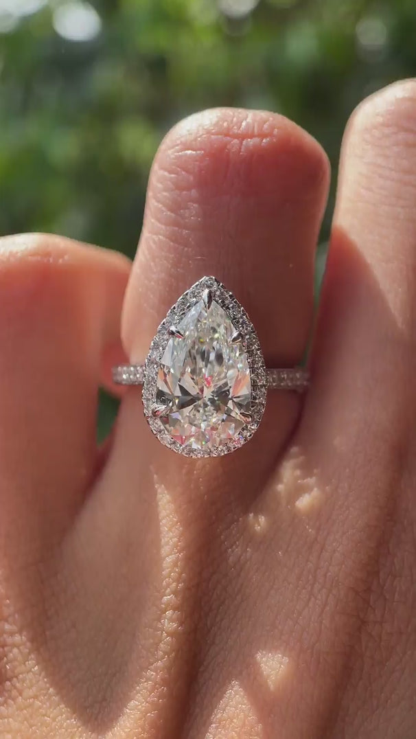 Pear cut lab grown diamond halo engagement ring in 10K white gold rotating view