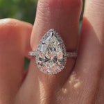 Pear cut lab grown diamond halo engagement ring in 10K white gold rotating view