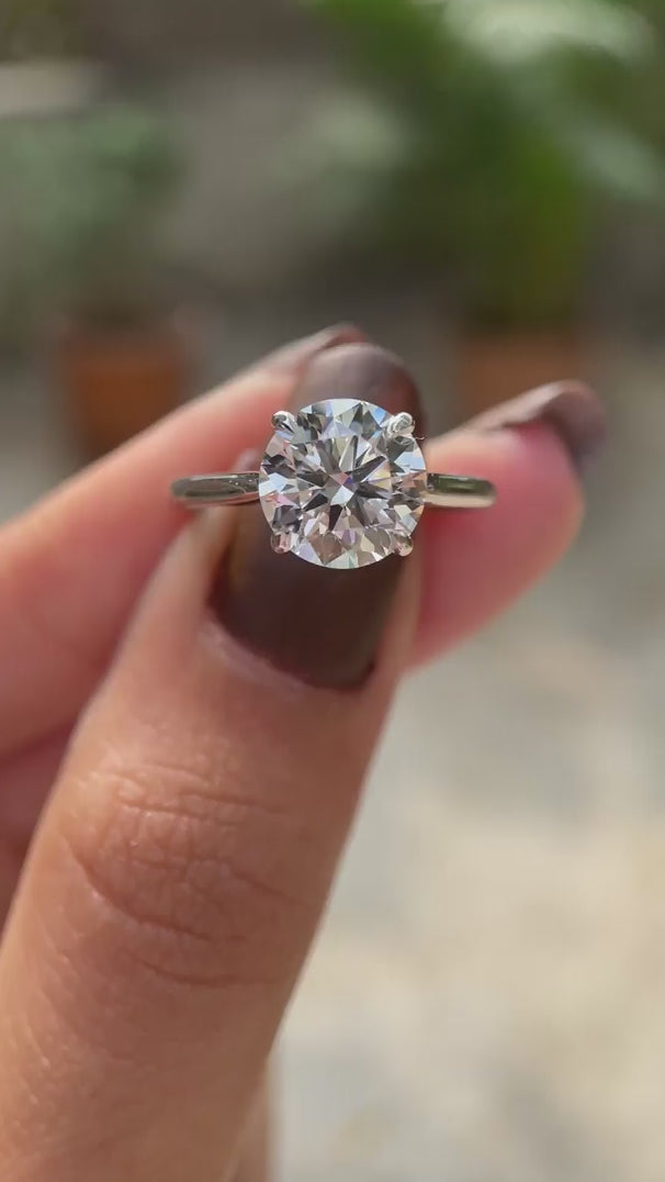 Round brilliant diamond solitaire engagement ring video