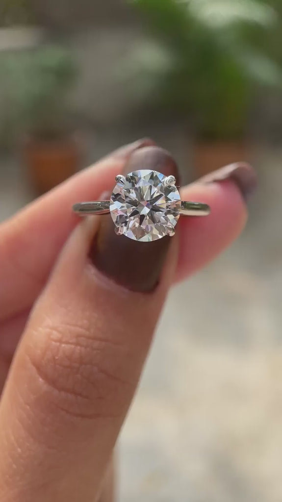 Round brilliant diamond solitaire engagement ring video
