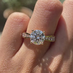 Channel set accent diamond ring with 8 mm round center stone video