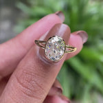 Oval Old Mine Cut moissanite bezel cathedral solitaire ring rotating view