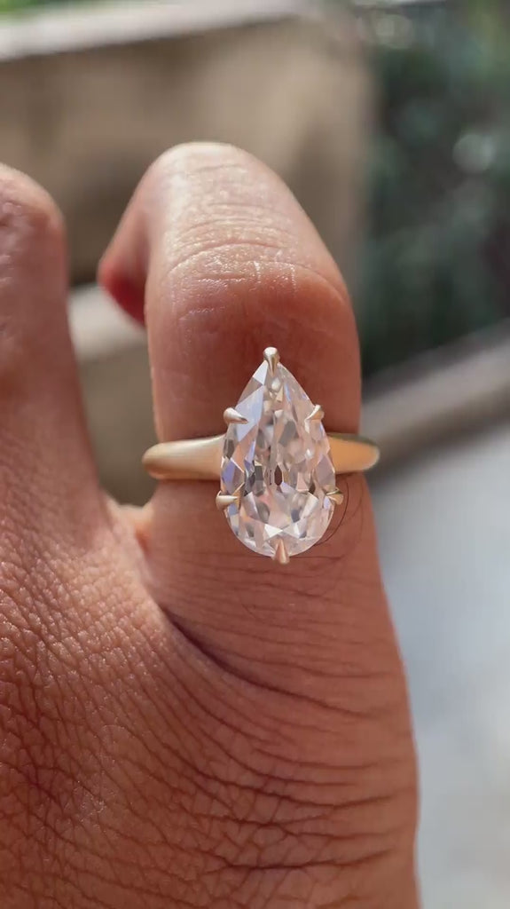 Rotating view of Old Mine Cut Pear Moissanite Ring in Yellow Gold