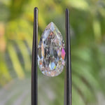 Rotating pear old mine cut moissanite showing sparkle