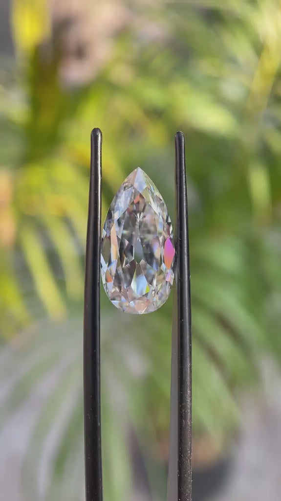 Rotating pear old mine cut moissanite showing sparkle