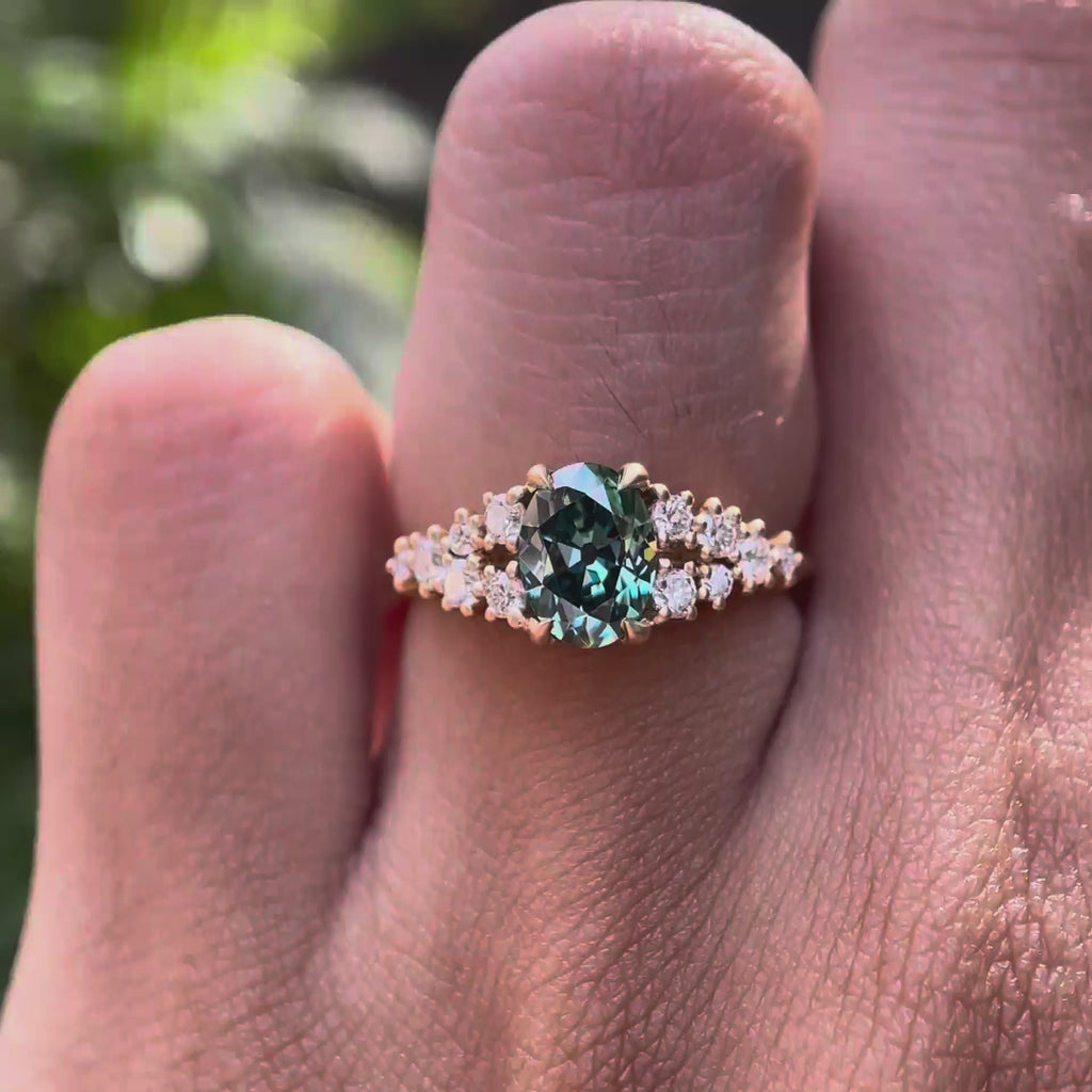 Oval blue green moissanite cluster ring rotating view
