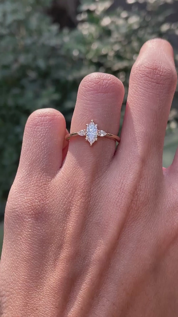 Marquise cut center stone with pear side stones yellow gold ring video