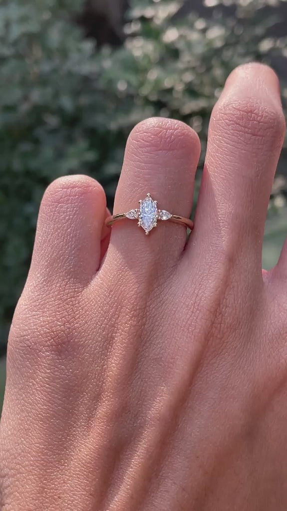 Marquise cut center stone with pear side stones yellow gold ring video