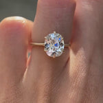 Elongated cushion solitaire engagement ring on hand view video