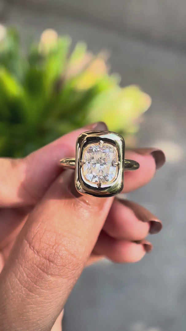 360 degree rotating view of cushion cut moissanite chunky ring in yellow gold