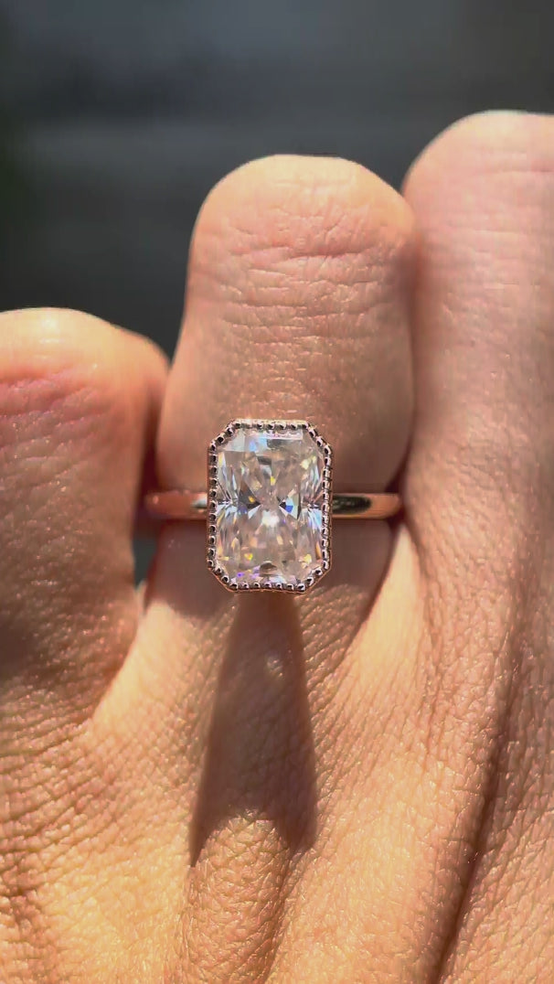 Radiant cut moissanite bezel set ring rotating view