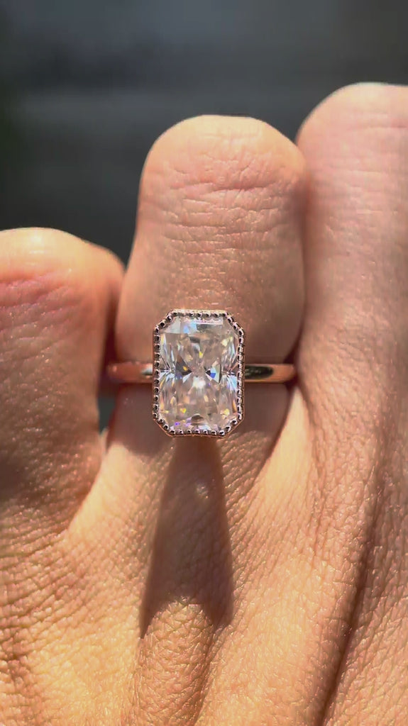 Radiant cut moissanite bezel set ring rotating view