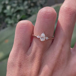 Dainty pear shaped lab diamond three stone ring on hand video