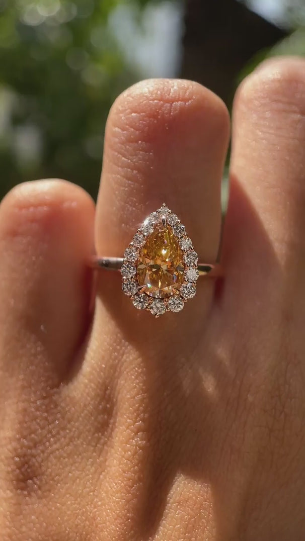 Pear cut brownish champagne moissanite halo engagement ring on hand video