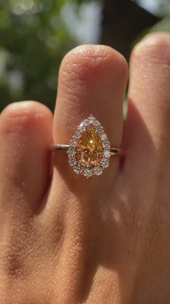 Pear cut brownish champagne moissanite halo engagement ring on hand video