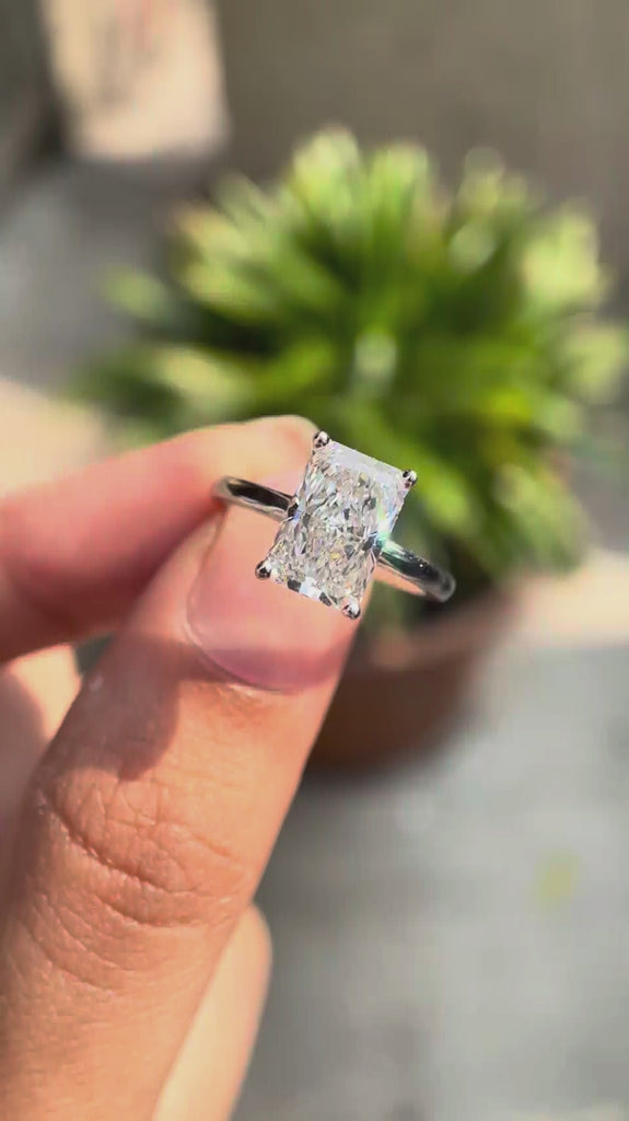 Radiant cut lab grown diamond solitaire engagement ring in 14K white gold rotating view