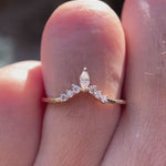 Close-up video of chevron V-shaped moissanite wedding band