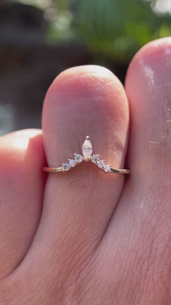 Close-up video of chevron V-shaped moissanite wedding band
