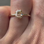 Champagne Solitaire showcasing the brilliance of the stone and the setting in motion.