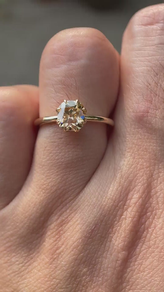 Champagne Solitaire showcasing the brilliance of the stone and the setting in motion.