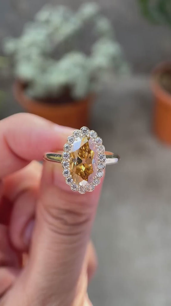 Oval champagne moissanite halo engagement ring yellow gold