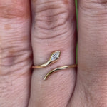 Product video showcasing the open marquise diamond snake ring in 14K yellow gold from multiple angles.