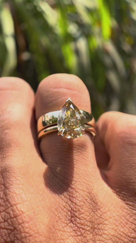 Rotating video of pear solitaire ring with hidden halo