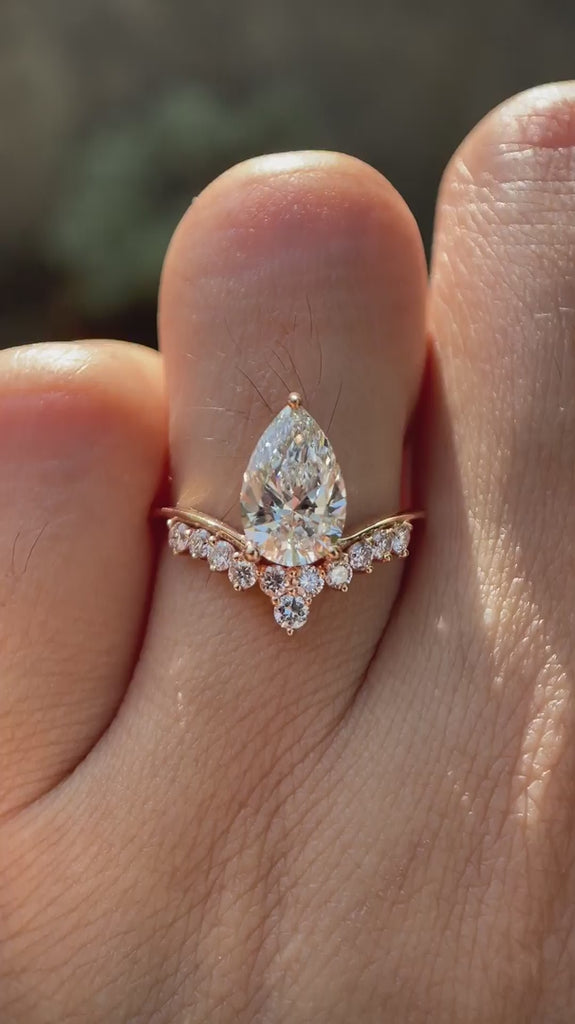 Pear cut lab grown diamond engagement ring in 14k rose gold shown in rotating video