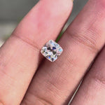 Cushion Peruzzi cut moissanite rotating to show brilliance and faceting