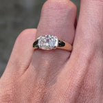 Modern half bezel moissanite engagement ring with bold chunky gold band
