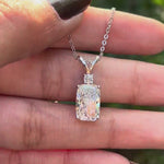 Close rotating view showing cushion diamond pendant with split V bail.