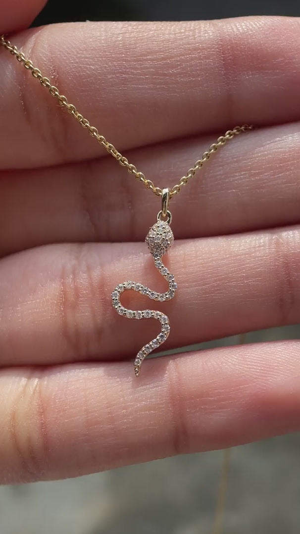 Dainty diamond snake pendant yellow gold video
